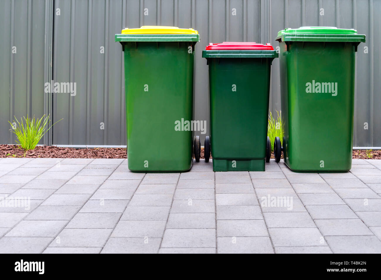Australian home outdoor bins set provided by local council placed on