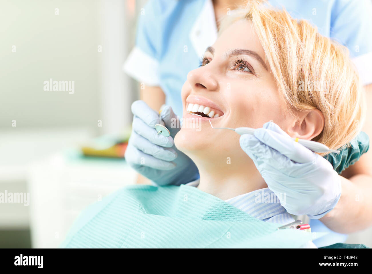 Dentist checks the teeth of a girl Stock Photo