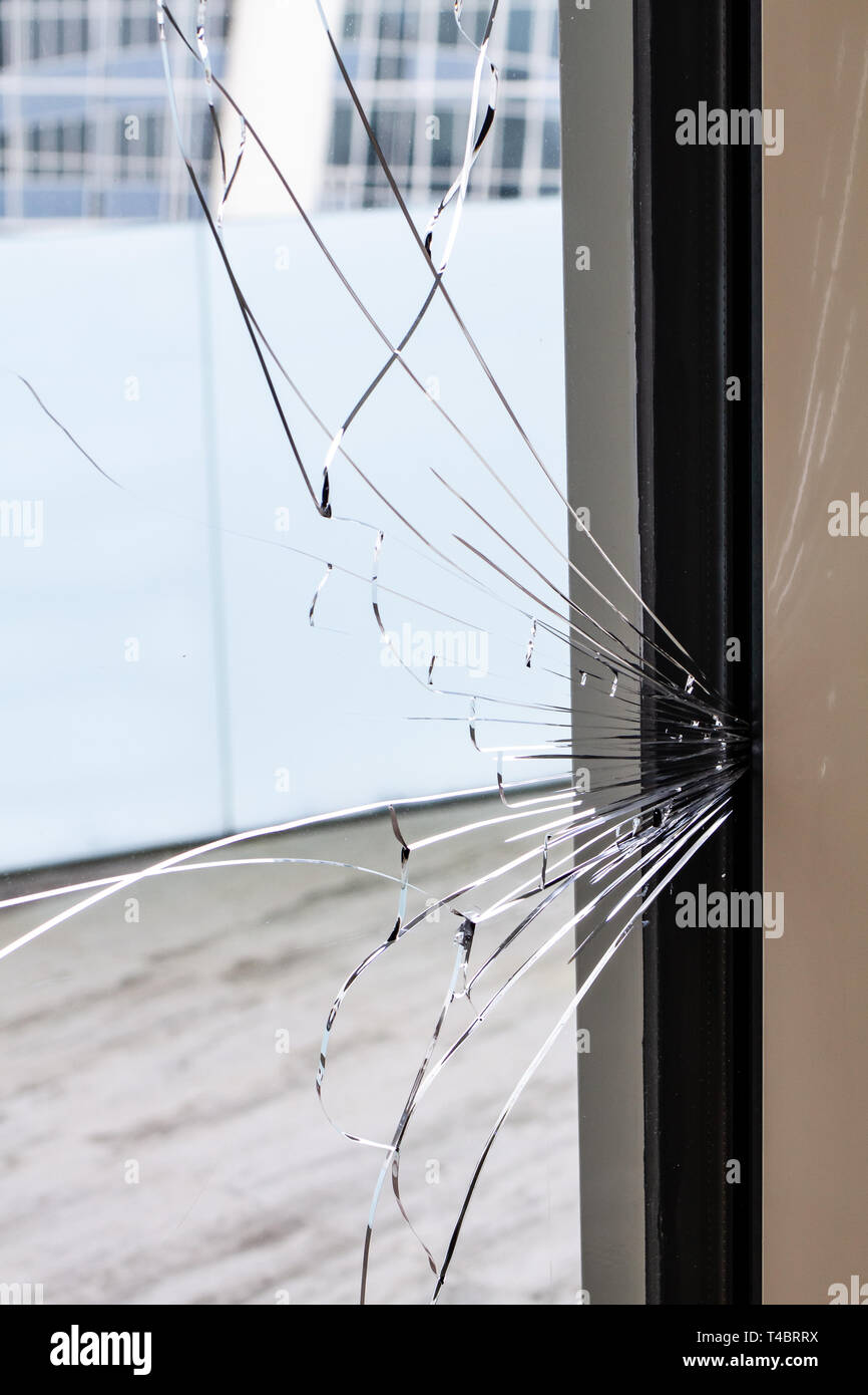 Cracked glass of a building. Damage or insurance concept Stock Photo