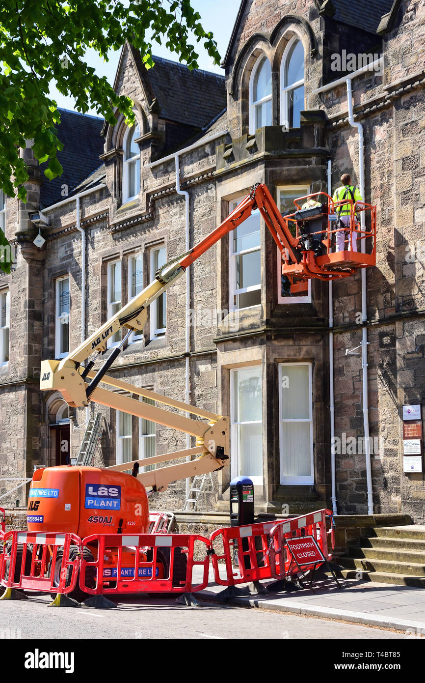 Workmen working from an hydraulic lift, Ness Walk, Inverness, Highland, Scotland, United Kingdom Stock Photo