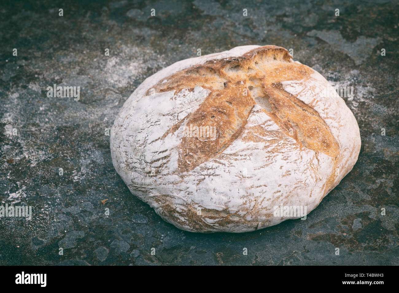 White sourdough bread on slate Stock Photo