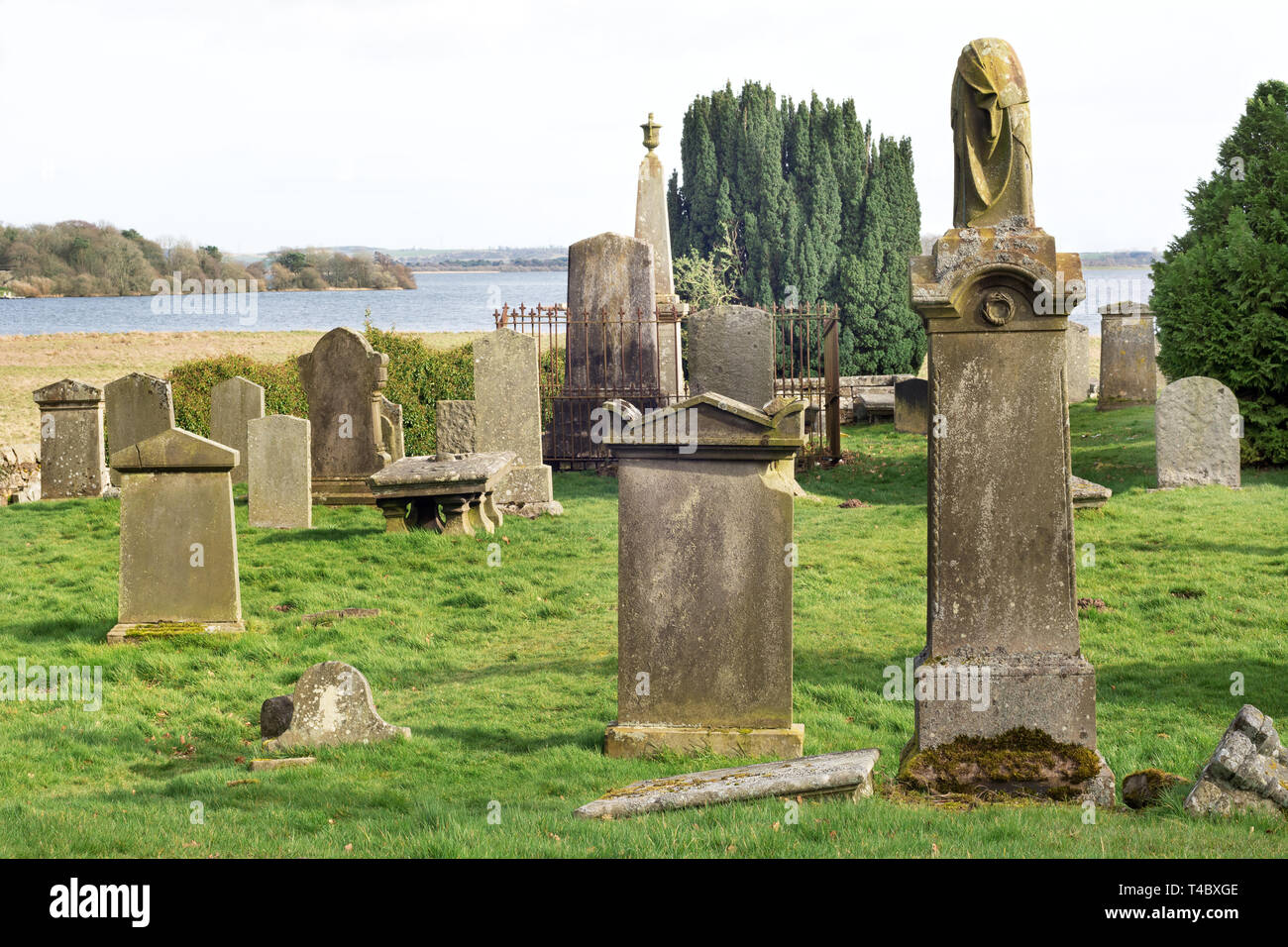 Old cemetery near the banks of Loch Leven in Scotland, UK. Loch Leven in the background Stock Photo