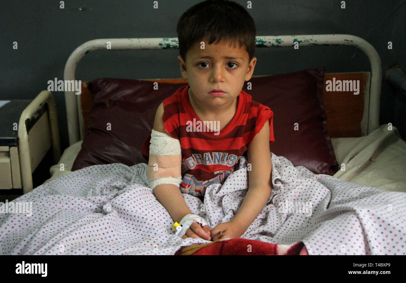 Mehtarlam, Afghanistan's eastern province of Laghman. 15th Apr, 2019. An injured child receives medical treatment at a hospital in Mehtarlam, capital of Afghanistan's eastern province of Laghman, April 15, 2019. About seven children were killed and 10 others wounded after a mortar shell exploded on outskirts of Mehtarlam, capital of Afghanistan's eastern province of Laghman on Sunday, provincial government spokesman Assadullah Dawlatzai said. Credit: Saifurahman Safi/Xinhua/Alamy Live News Stock Photo