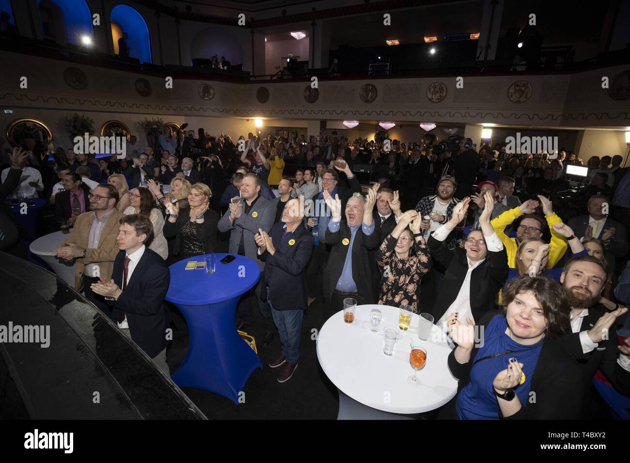 Helsinki, Finland. 14th Apr, 2019. Finns Party supporters celebrate during the party's election night event in Helsinki, Finland, April 14, 2019. Finland's opposition Social Democratic Party is to become the biggest in parliament with 40 seats, the national broadcaster Yle predicted late on Sunday. The prognosis said the Social Democrats would get 40 seats, the populist Finns Party would have 39 seats, and the conservative National Coalition Party, 38. Credit: Matti Matikainen/Xinhua/Alamy Live News Stock Photo