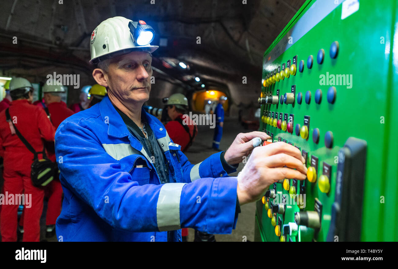 Gorleben, Germany. 15th Apr, 2019. A miner controls an elevator underground in the former exploration mine. After decades of dispute over a repository for highly radioactive nuclear waste in Gorleben, the exploration area of the mine has been almost completely dismantled. During a symbolic final inspection of the salt dome it was now shown what the so-called open-keeping operation looks like. Credit: Philipp Schulze/dpa/Alamy Live News Stock Photo
