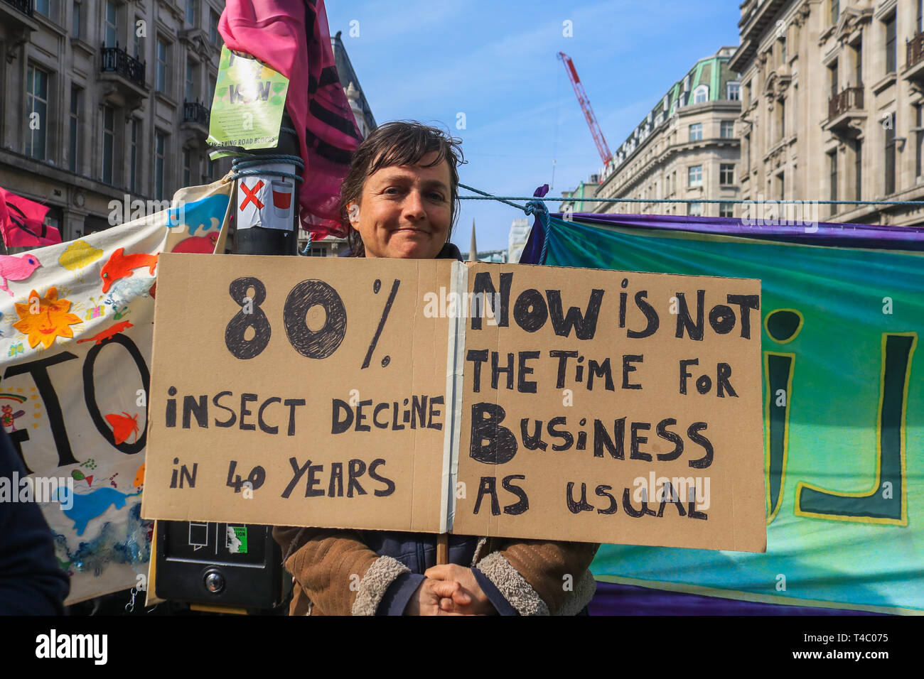 London, UK. 15th Apr, 2019. Hundreds of Environment activists from Extinction Rebellion take part in a sit in protest in Oxford Circus and across parts of central London to highlight the threat of global warming on the planet and ecosystem and to urge the government to take action Credit: amer ghazzal/Alamy Live News Stock Photo