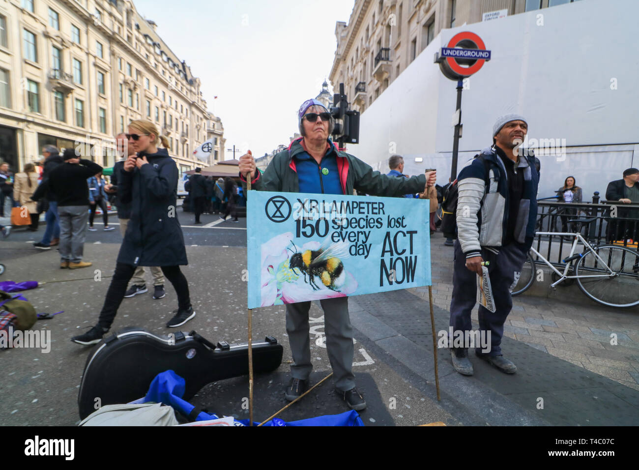 London, UK. 15th Apr, 2019. Hundreds of Environment activists from Extinction Rebellion take part in a sit in protest in Oxford Circus and across parts of central London to highlight the threat of global warming on the planet and ecosystem and to urge the government to take action Credit: amer ghazzal/Alamy Live News Stock Photo