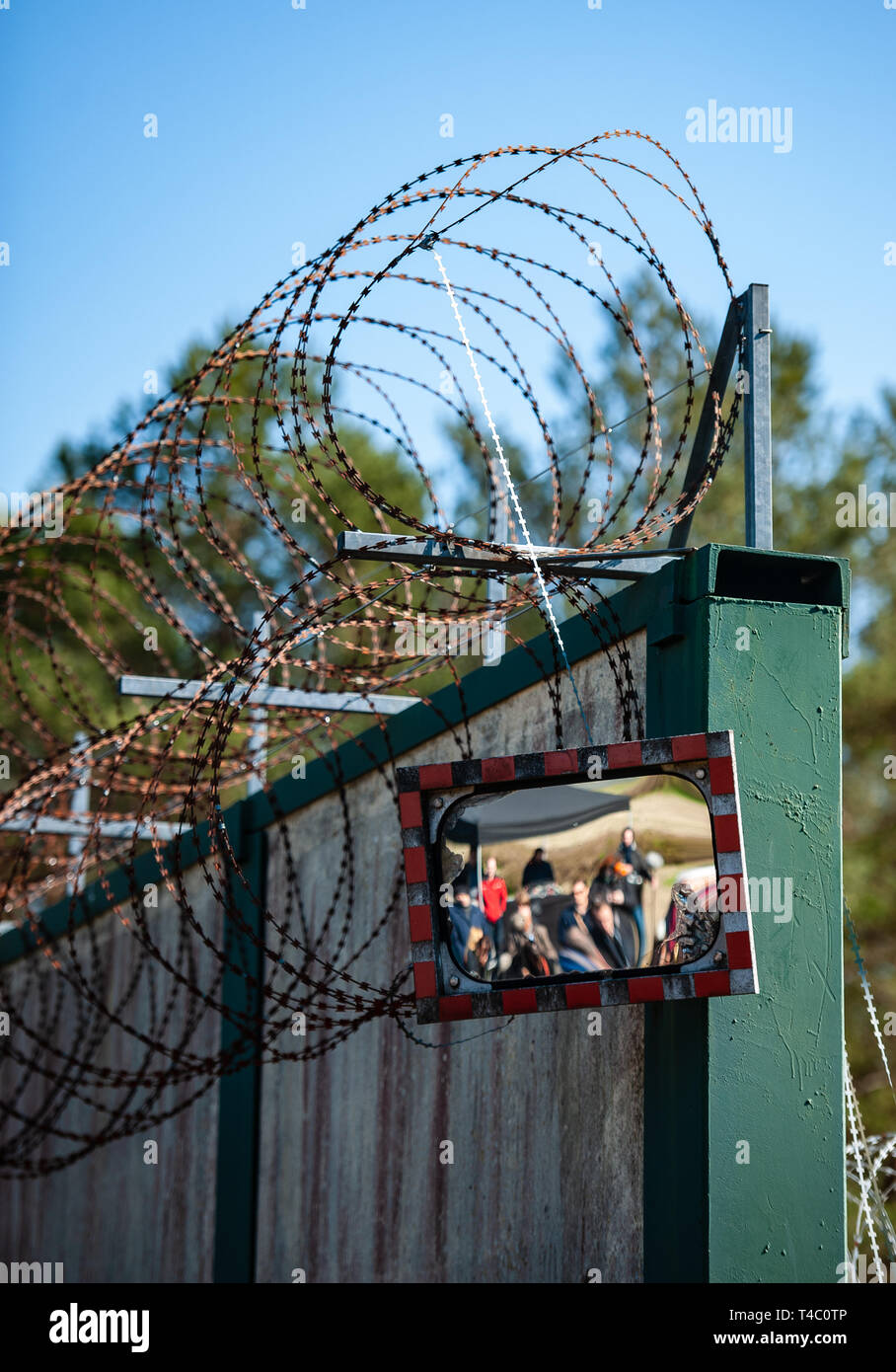 Gorleben, Germany. 15th Apr, 2019. A wall with so-called NATO wire surrounds the former exploratory mine. After decades of dispute over a repository for highly radioactive nuclear waste in Gorleben, the exploration area of the mine has been almost completely dismantled. During a symbolic final inspection of the salt dome it was now shown what the so-called open-keeping operation looks like. Credit: Philipp Schulze/dpa/Alamy Live News Stock Photo