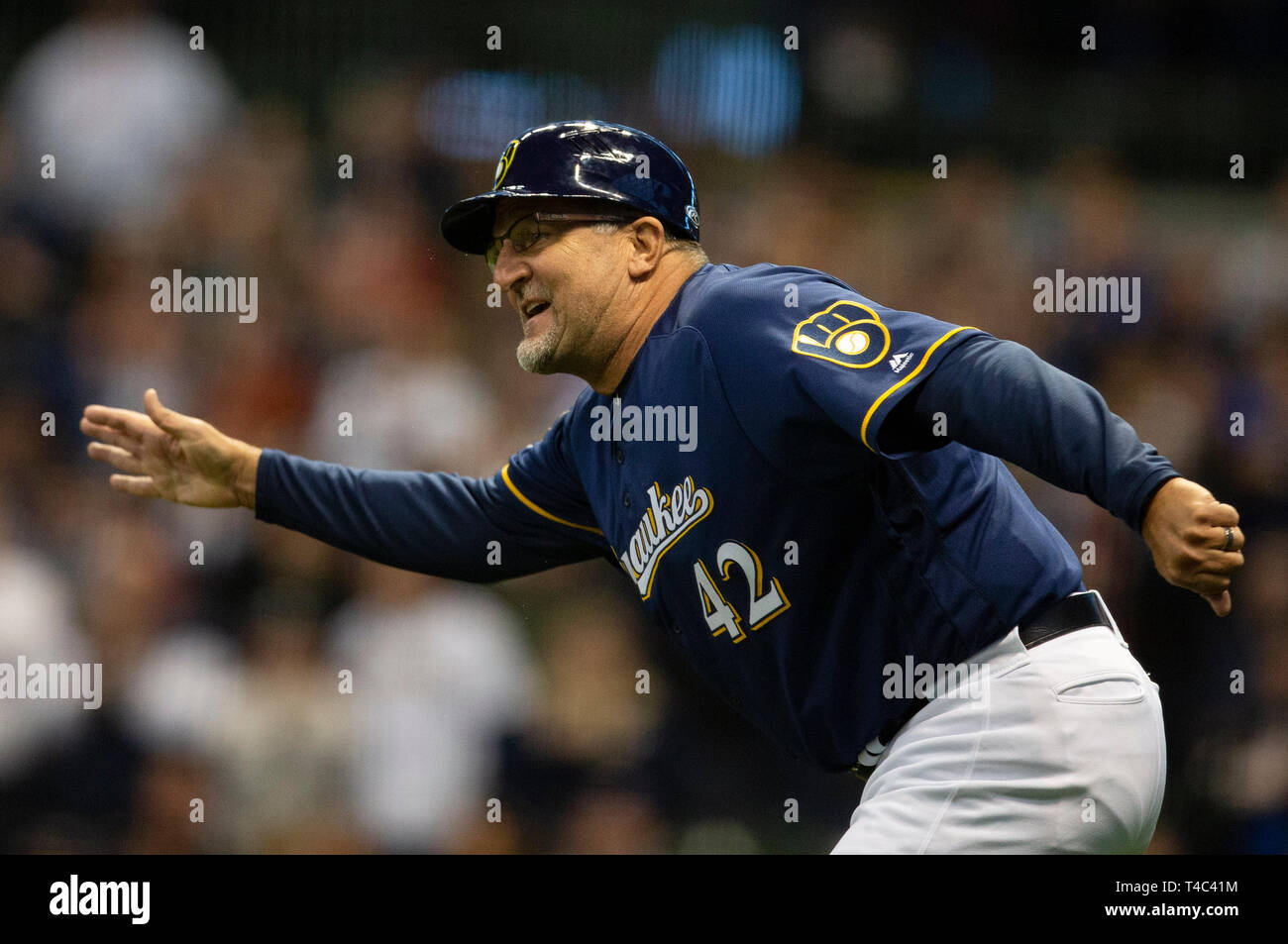 Milwaukee, WI, USA. 15th Apr, 2019. Milwaukee Brewers third base coach Ed Sedar #42 congratulates Milwaukee Brewers Mike Moustakas after hitting a solo home run in the first inning of the Major League Baseball game between the Milwaukee Brewers and the St. Louis Cardinals at Miller Park in Milwaukee, WI. John Fisher/CSM/Alamy Live News Stock Photo