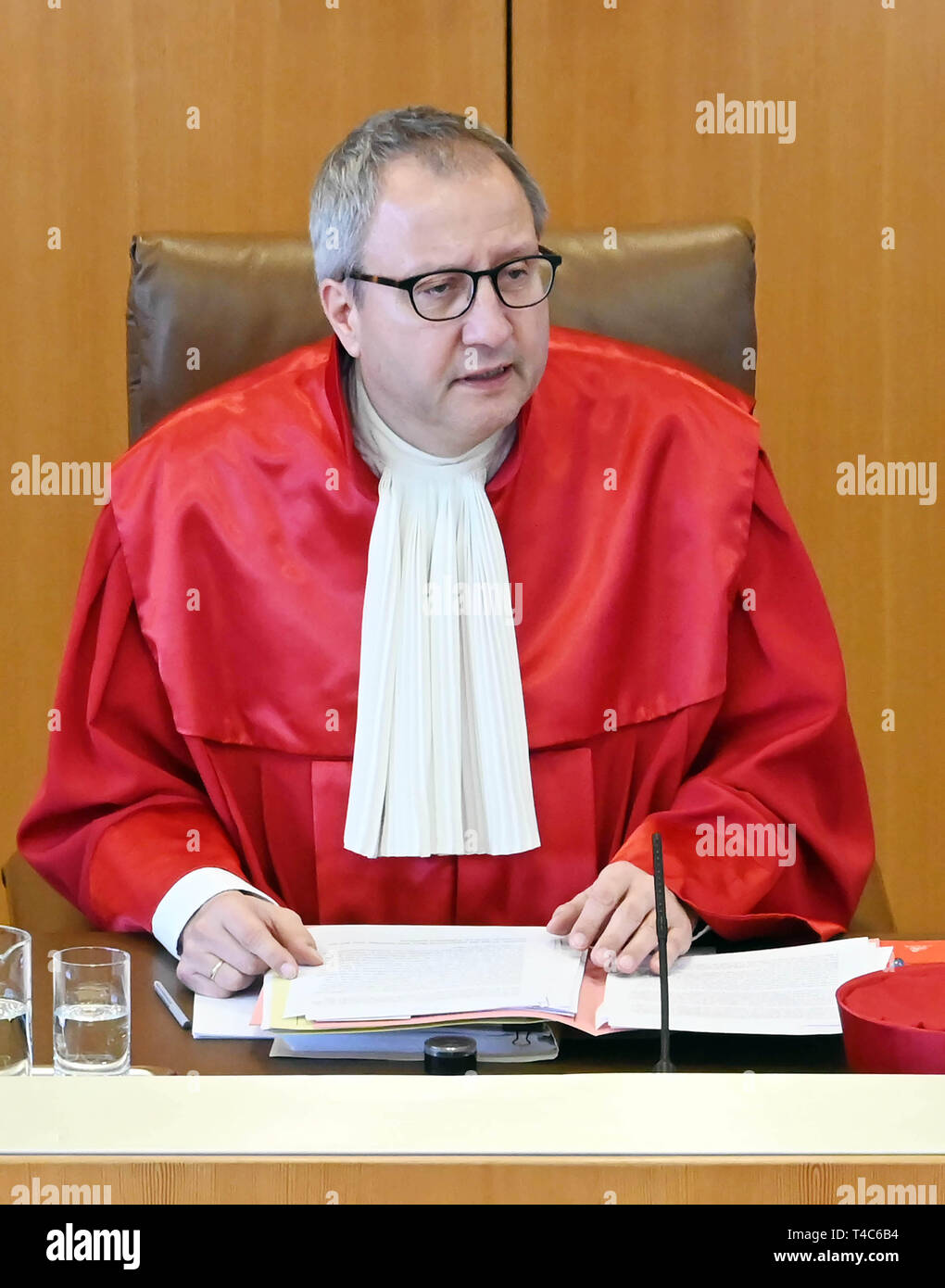 16 April 2019, Baden-Wuerttemberg, Karlsruhe: Andreas Voßkuhle, Chairman of the Second Senate of the Federal Constitutional Court, opens the oral hearing on the ban on euthanasia. Euthanasia as a service has been a punishable offence for a good three years now. The court is hearing a number of lawsuits against the ban. With Section 217 of the Criminal Code, the legislator wanted to prevent suicide assistance associations such as Sterbehilfe Deutschland or Dignitas from Switzerland from expanding their services for paying members. Apart from such associations, palliative physicians and other do Stock Photo
