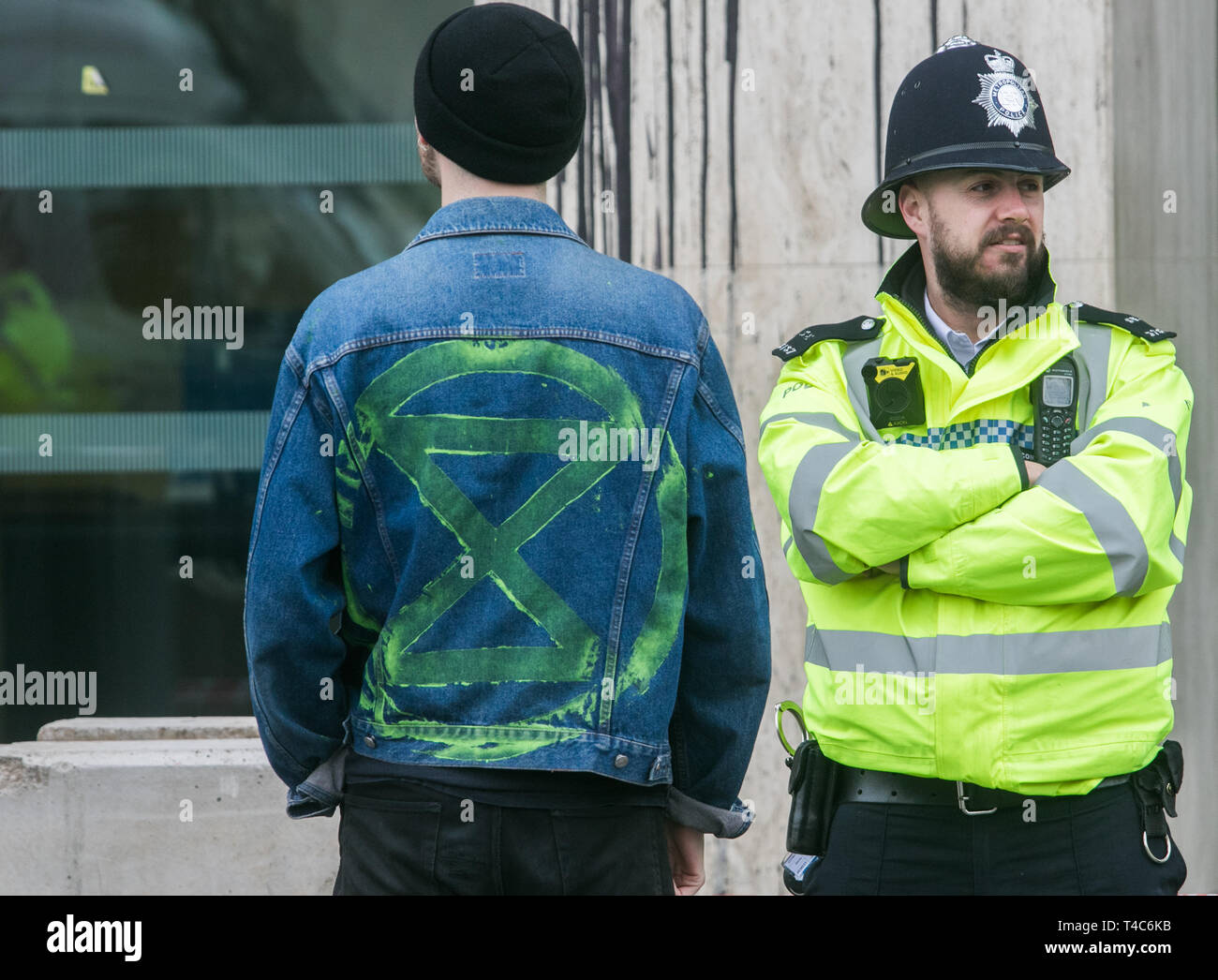 London, UK. 16th Apr 2019. Climate activists from Extinction Rebellion continue to protest at the Shell Centre in a standoff with Police. The Shell centre was daubed with graffiti by climate activists and Eco warriors a day earlier as they brought major parts of London to a standstill in an effort to highlight awareness on global warming and CO2 emssions Credit: amer ghazzal/Alamy Live News Stock Photo