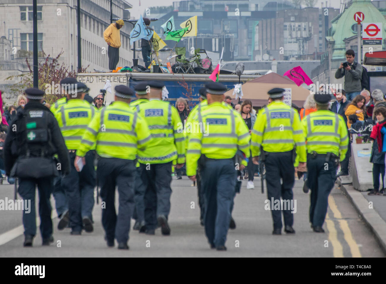 London, UK. 16th Apr, 2019. Police warn people blocking Waterloo Bridge under the public order act and then arrest them if they refuse to move to Marble Arch. It is mostly good humoured but some are dragged away to cheers from the remainder -  Day 2 - Protestors from Extinction Rebellion block several (Hyde Park, Oxford Cuircus, Warterloo Bridge and Parliament Square) junctions in London as part of their ongoing protest to demand action by the UK Government on the 'climate chrisis'. The action is part of an international co-ordinated protest. Credit: Guy Bell/Alamy Live News Stock Photo