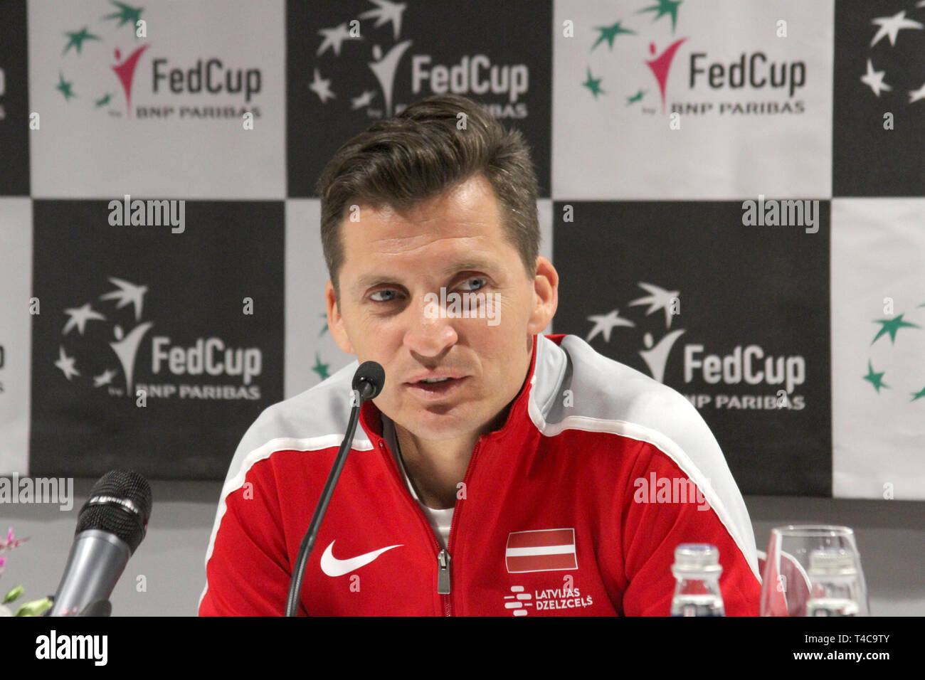 Riga, Latvia. 16th Apr, 2019. The Latvian team boss Adrians Zguns speaks at  the press conference before the Fed Cup delegation match of the German  tennis ladies against the Latvian in Latvia