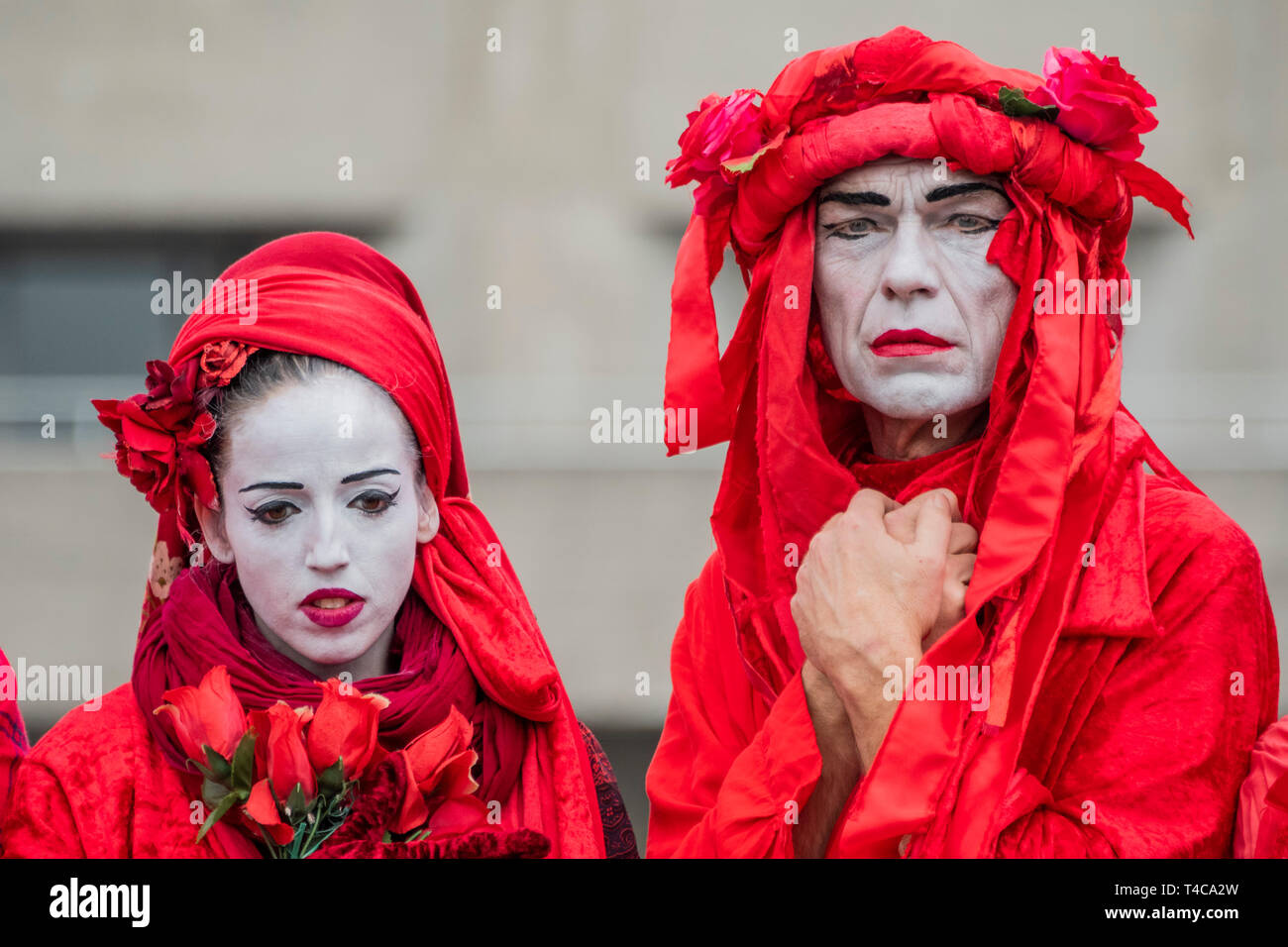London, UK. 16th Apr, 2019. Performance artists, on Waterloo Bridge, represent the blood of all the species which will become exctinct, including possibly humans - Day 2 - Protestors from Extinction Rebellion block several (Hyde Park, Oxford Cuircus, Warterloo Bridge and Parliament Square) junctions in London as part of their ongoing protest to demand action by the UK Government on the 'climate chrisis'. The action is part of an international co-ordinated protest. Credit: Guy Bell/Alamy Live News Stock Photo