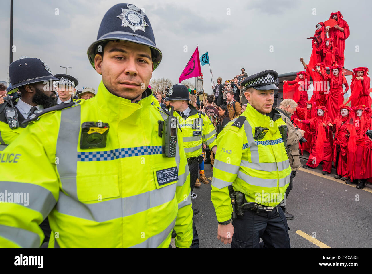 London, UK. 16th Apr, 2019. Police make arrests on Waterloo Bridge and are pointed at by performers repesenting the blood of species that will become extinct. It is mostly good humoured but some are dragged away to cheers from the remainder - Day 2 - Protestors from Extinction Rebellion block several (Hyde Park, Oxford Cuircus, Warterloo Bridge and Parliament Square) junctions in London as part of their ongoing protest to demand action by the UK Government on the 'climate chrisis'. The action is part of an international co-ordinated protest. Credit: Guy Bell/Alamy Live News Stock Photo