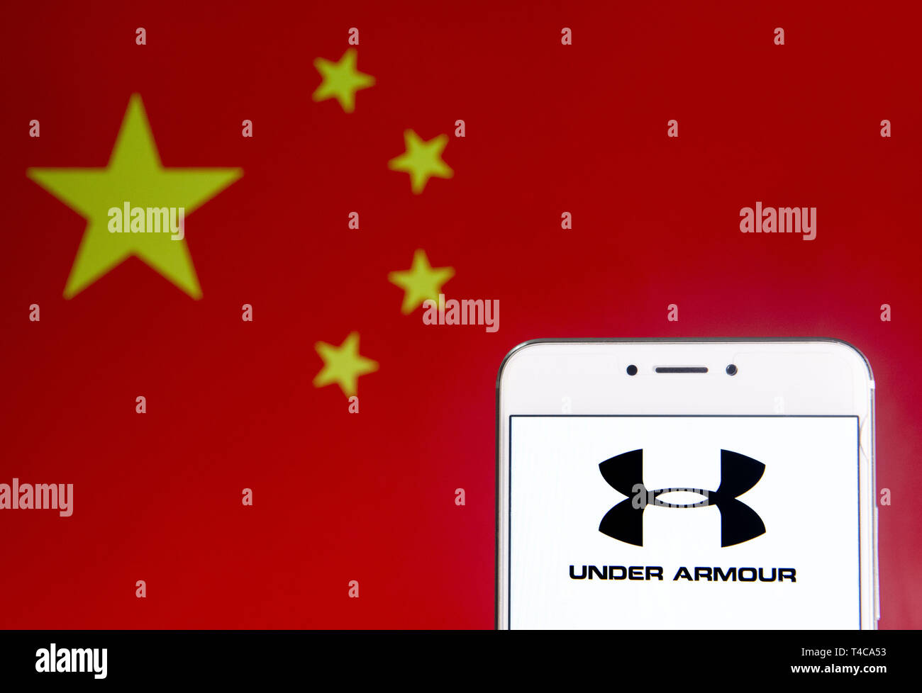 Hong Kong. 6th Apr, 2019. In this photo illustration a American  multinational clothing brand Under Armour logo is seen on an Android mobile  device with People's Republic of China flag in the