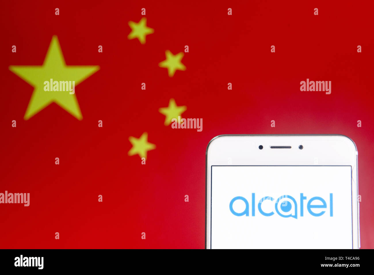 Hong Kong. 6th Apr, 2019. In this photo illustration a French global telecommunications equipment company Alcatel logo is seen on an Android mobile device with People's Republic of China flag in the background. Credit: Budrul Chukrut/SOPA Images/ZUMA Wire/Alamy Live News Stock Photo