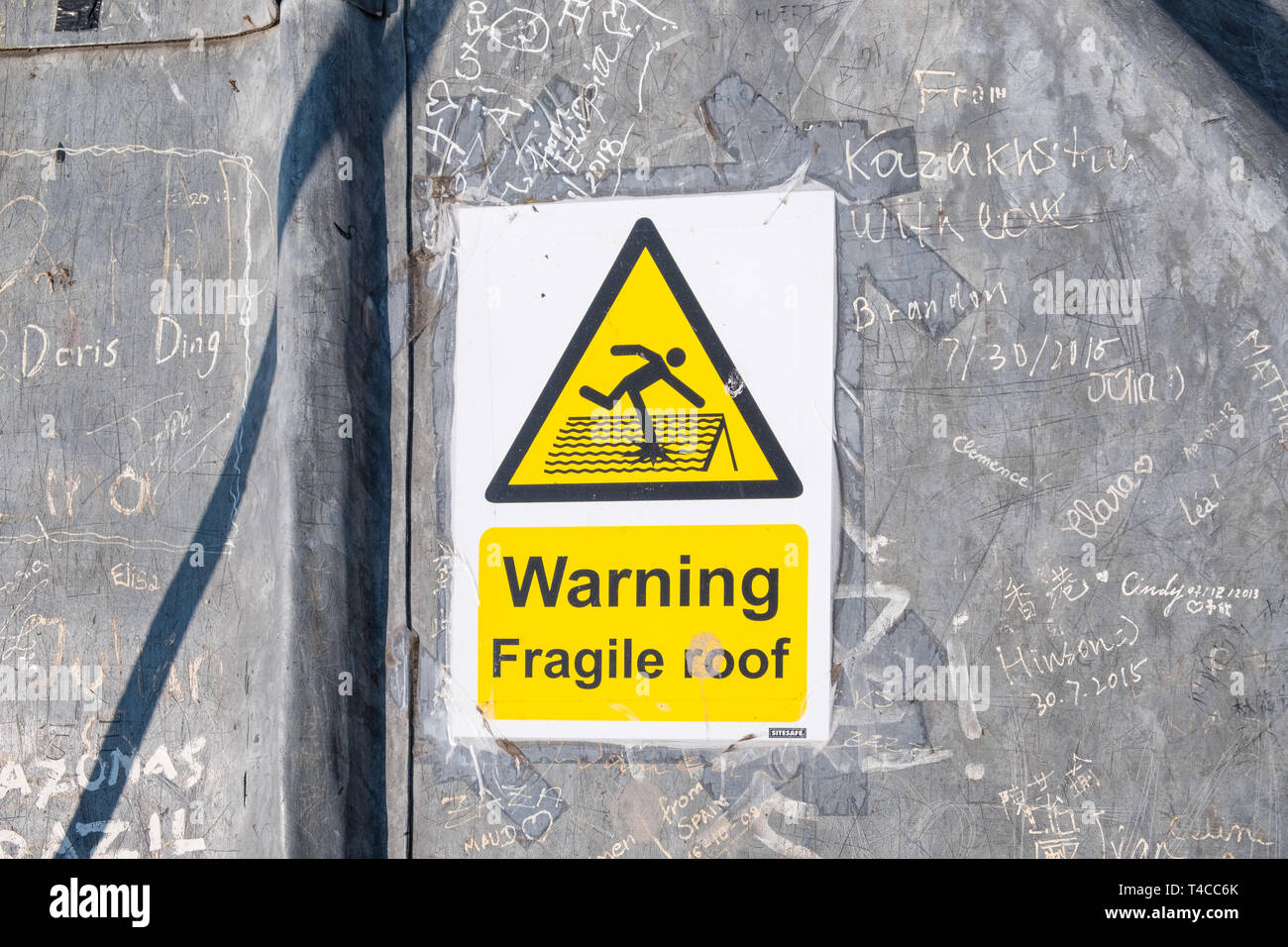 Warning of fragile roof on the viewing platform on the rooftop of the 12th Century Carfax Tower in Oxford, UK Stock Photo