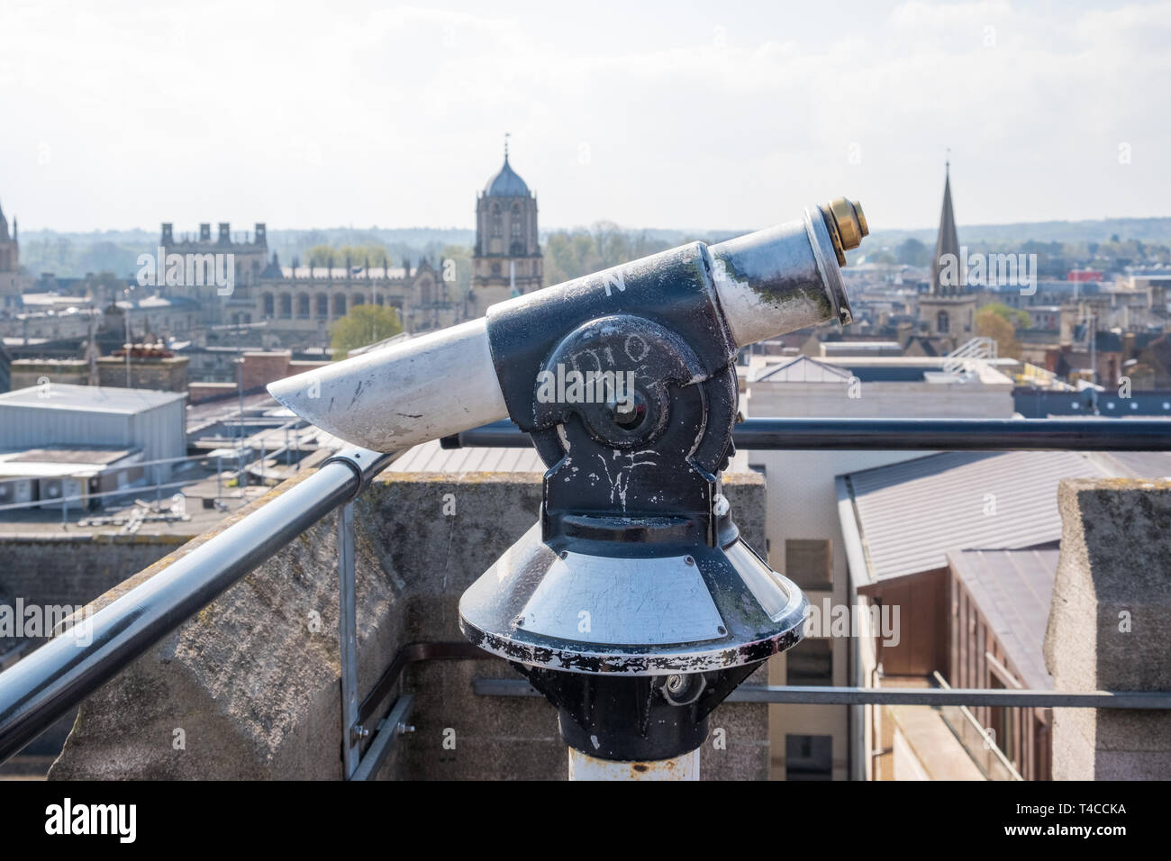 Coin operated telescope on the viewing platform on the rooftop of the 12th Century Carfax Tower in Oxford, UK Stock Photo