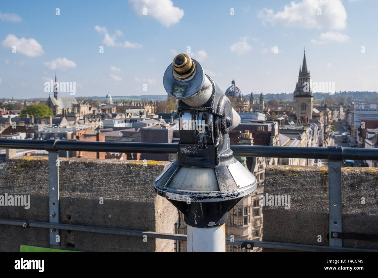 Coin operated telescope on the viewing platform on the rooftop of the 12th Century Carfax Tower in Oxford, UK Stock Photo