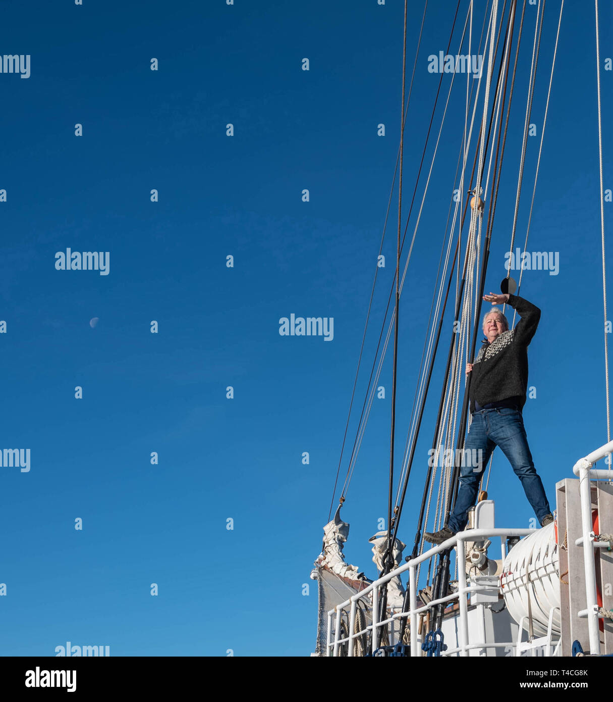 Man looking out to sea, Rembrant Van Rijn, Schooner Ship, Scoresbysund, Greenland Stock Photo