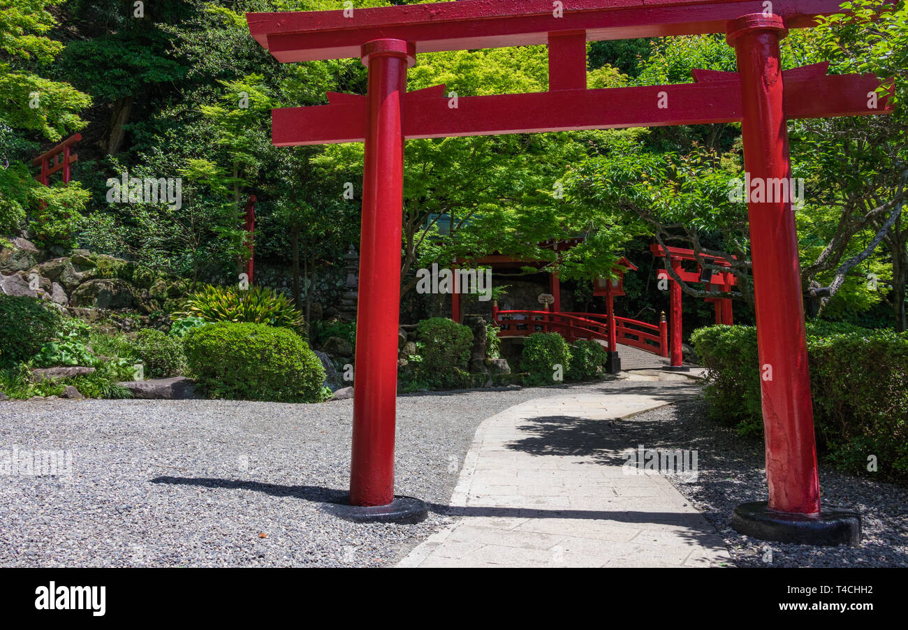 Traditional, red Torii and entrance path to japanese Jigoku Meguri ...