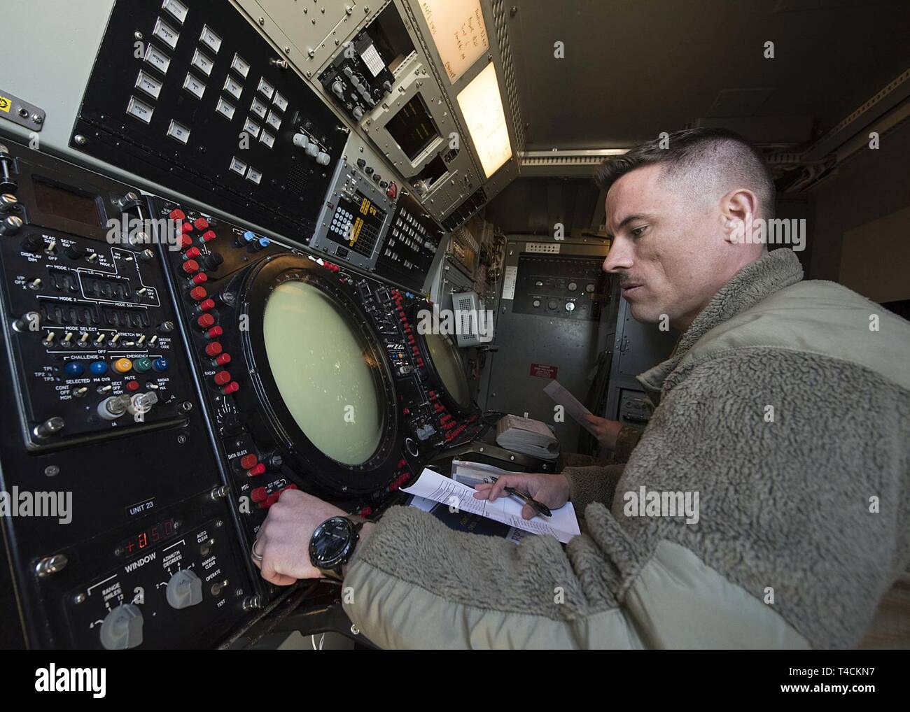 U.S. Air Force Tech. Sgt. Blake Johnson, 726th Air Control Squadron (ACS)  Command and Control Battle Management Operator, looks over a radar on the  Nevada Test and Training Range (NTTR) March 19,
