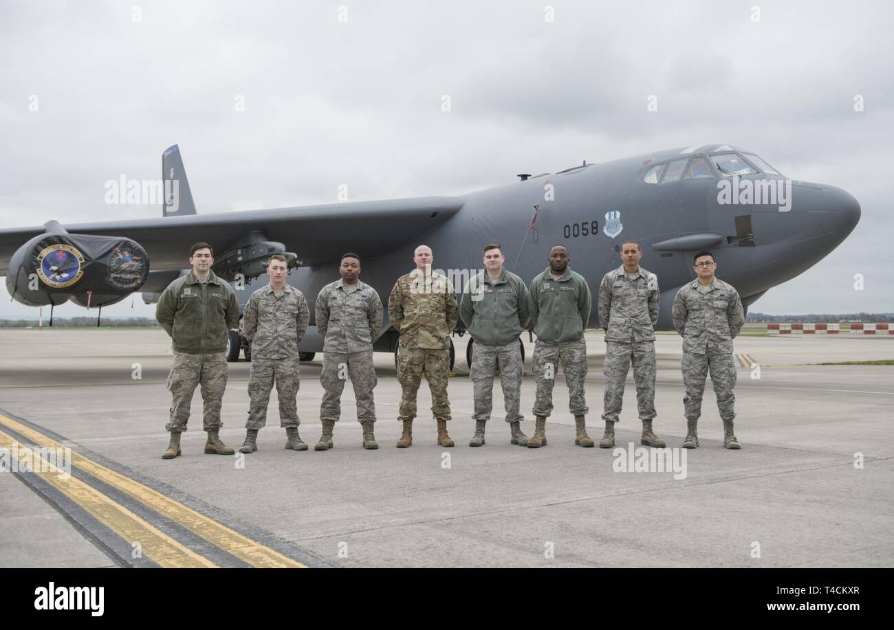 The 422nd Communications Squadron poses in front of a B-52 Stratofortress after the Bomber Task Force in Europe 2019 media day at RAF Fairford, England, March 19, 2019. The contingent of B-52 Stratofortress aircraft, Airmen and support equipment is from the 2nd Bomb Wing, Barksdale Air Force Base, La., to support the Bomber Task Force in Europe. The deployment of strategic bombers to the U.K. helps exercise RAF Fairford as U.S. Air Forces in Europe’s forward operating location for bombers. The deployment includes joint and allied training to enhance interoperability and readiness. Stock Photo