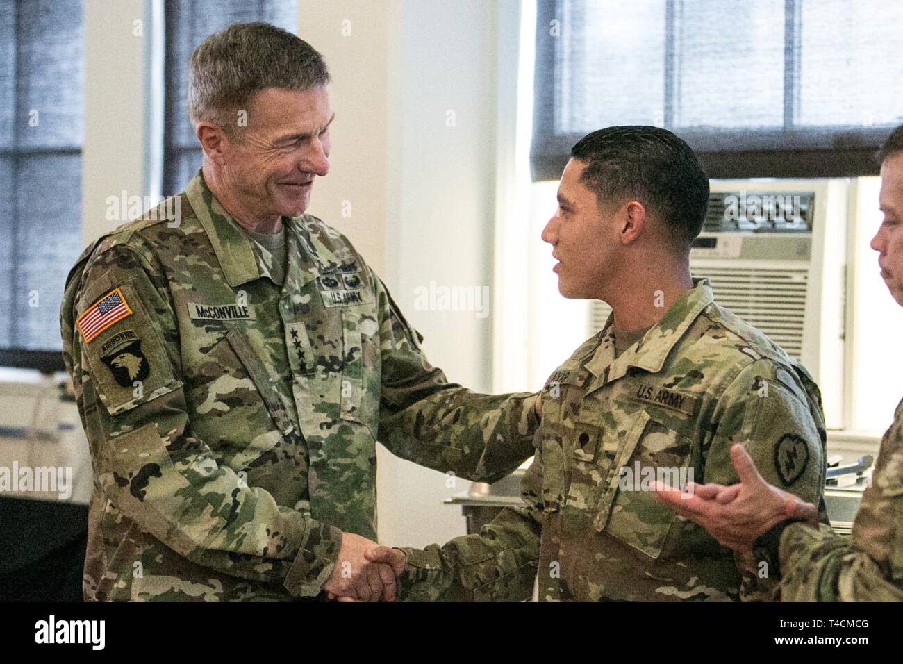 A Tropic Lightning Soldier receives recognition from Gen. James C.  McConville, . Army Vice Chief of Staff, for their hard work and  dedication to America's Pacific Division on Wheeler Army Airfield, Hawaii,