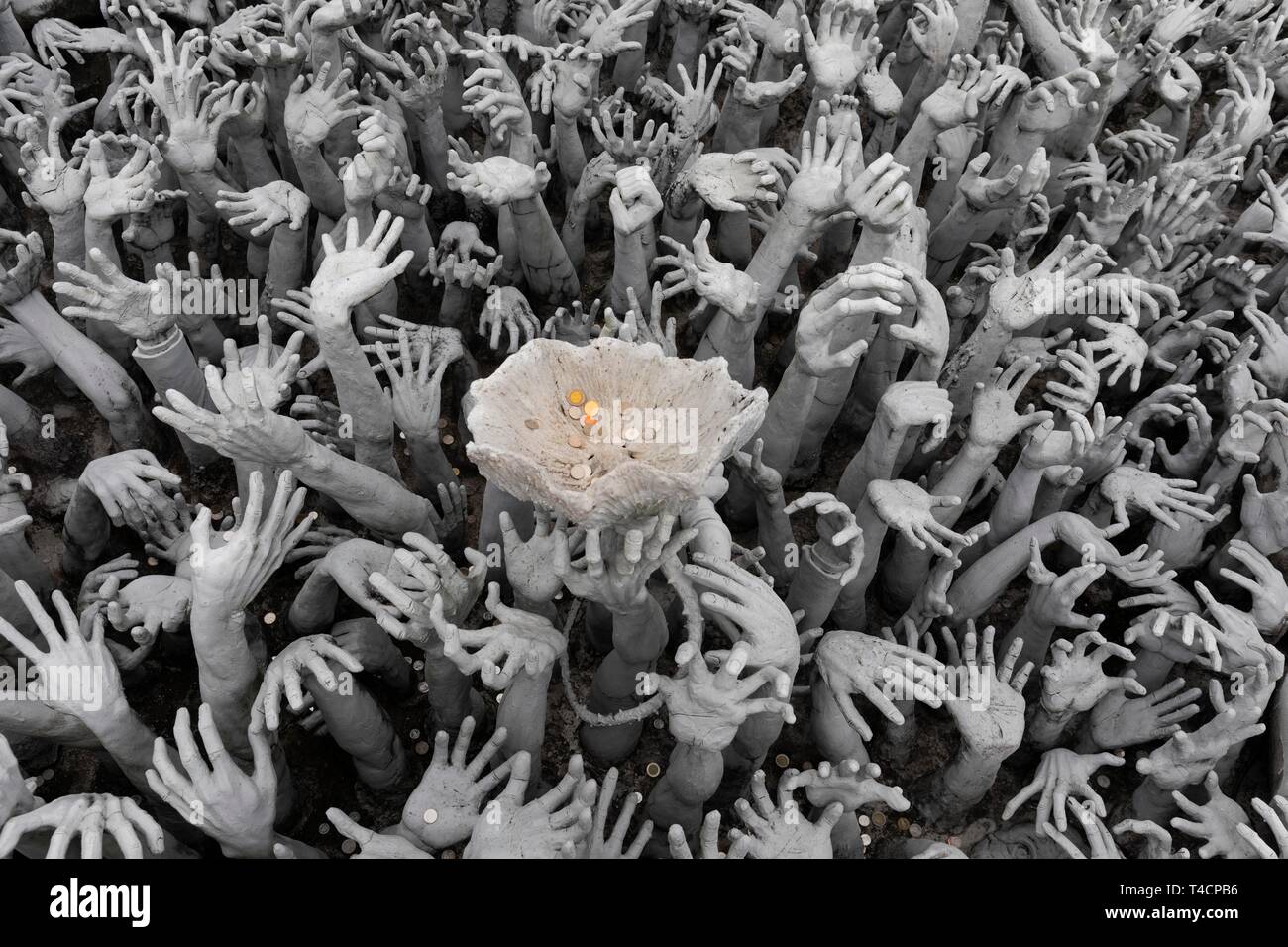 Hands pleading for help, representation of hell, bridge to the entrance of white temples, Wat Rong Khun, Chiang Rai, Northern Thailand, Thailand Stock Photo