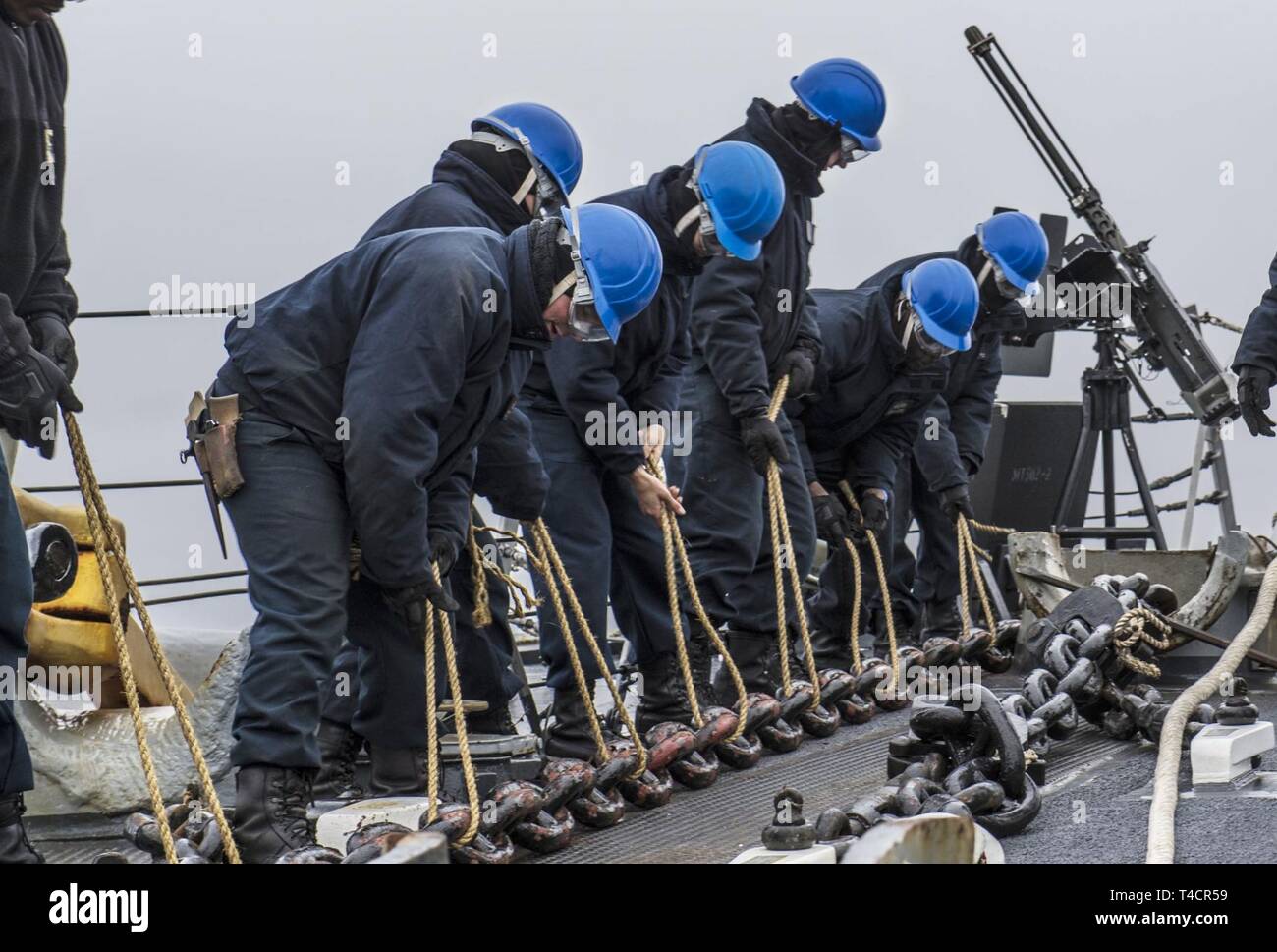 190320-N-KA046-0183  ENGLISH CHANNEL (March 20, 2019) Sailors participate in a mooring to buoy exercise in support of Flag Officer Sea Training aboard the Arleigh Burke-class guided-missile destroyer USS Porter (DDG 78) in the English Channel, March 20, 2019. Porter, forward-deployed to Rota, Spain, is on its sixth patrol in the U.S. 6th Fleet area of operations in support of U.S national security interests in Europe and Africa. (U.S. Navy photo by Mass Communication Specialist 2nd Class James R. Turner/Released) Stock Photo
