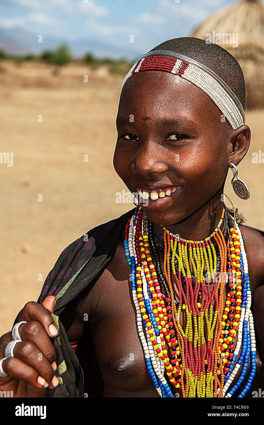 Laughing young woman with necklace, from the tribe of Erbore, Turmi, Lower Omo Valley, Omo Region, South Ethiopia, Ethiopia Stock Photo