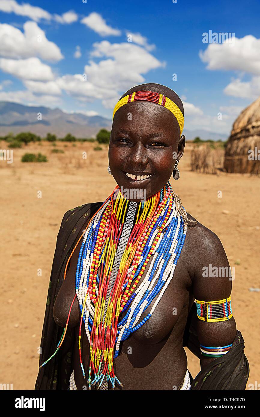 Laughing young woman with necklace, from the tribe of Erbore, Turmi, region, southern Ethiopia, Ethiopia Stock Photo