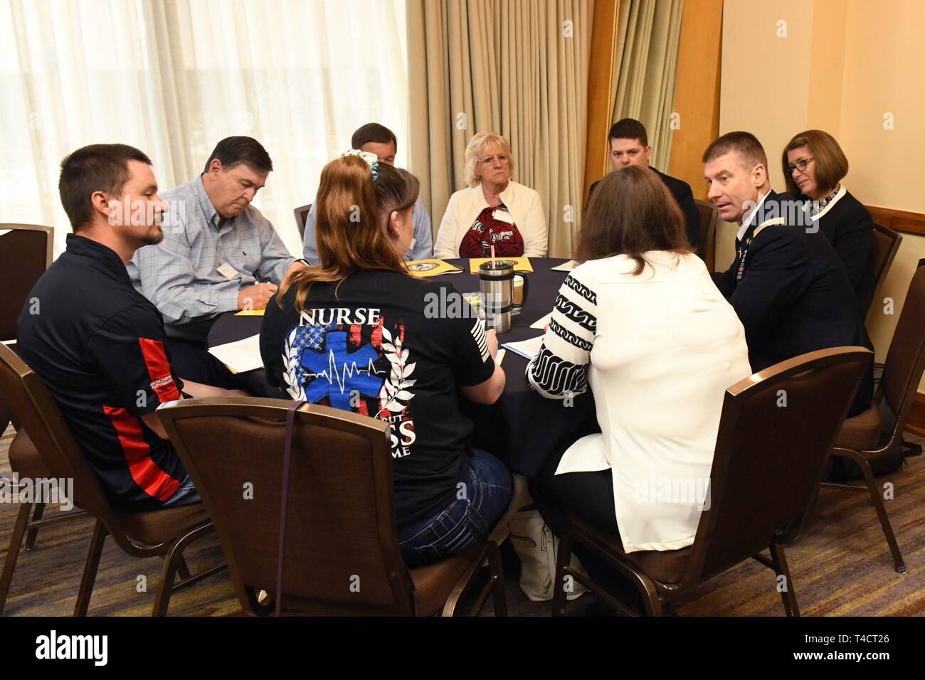 A Family Participates In A One On One Briefing About Their