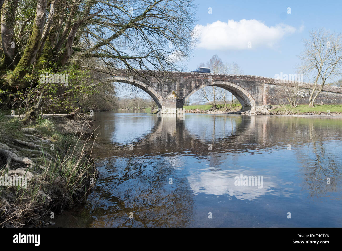 Ouse Bridge over the River Derwent at the outlet of Bassenthwaite Lake, Dubwath, Cumbria, England, UK Stock Photo