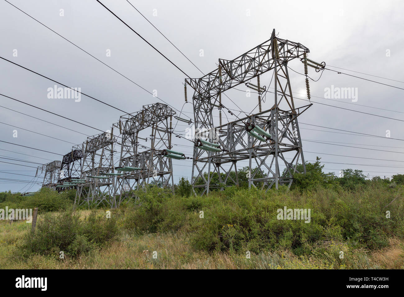 High voltage power lines towers on island of Khortytsia in Ukraine. Stock Photo