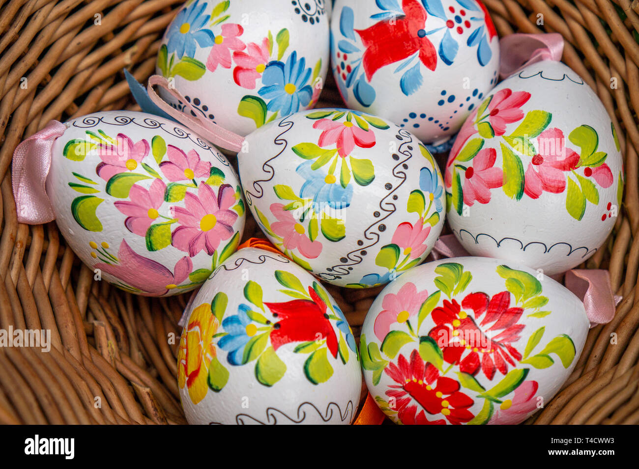 Close up of colorful decorted hand painted Easter eggs in a basket Stock Photo