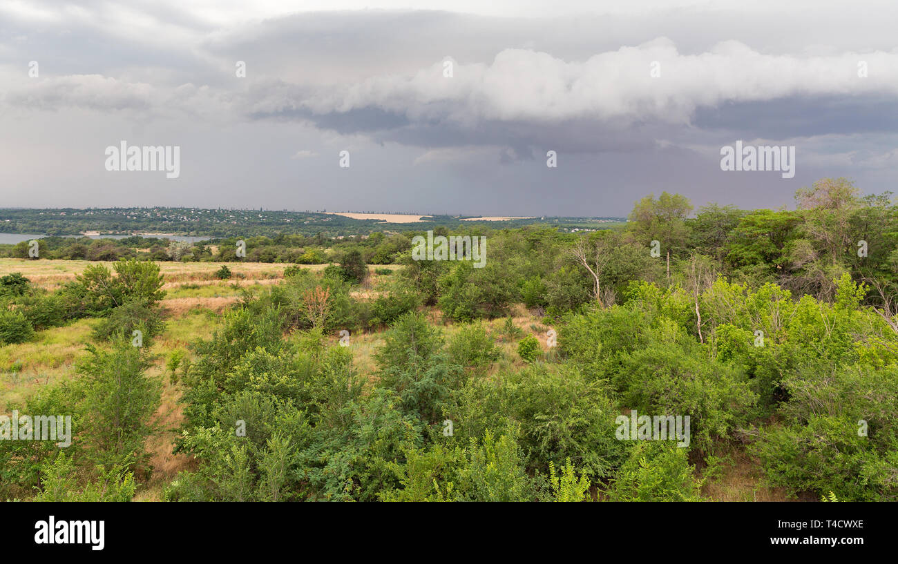 Thunder sky over summer landscape over Khortytsia island and Dnieper river, Ukraine Stock Photo