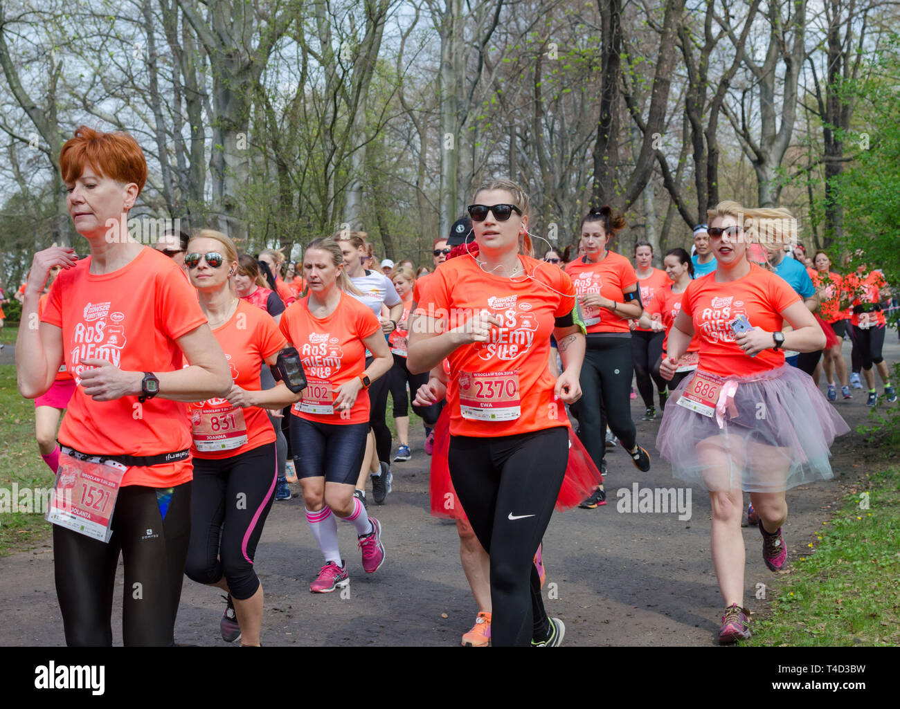 Group people jogging in park hi-res stock photography and images - Alamy
