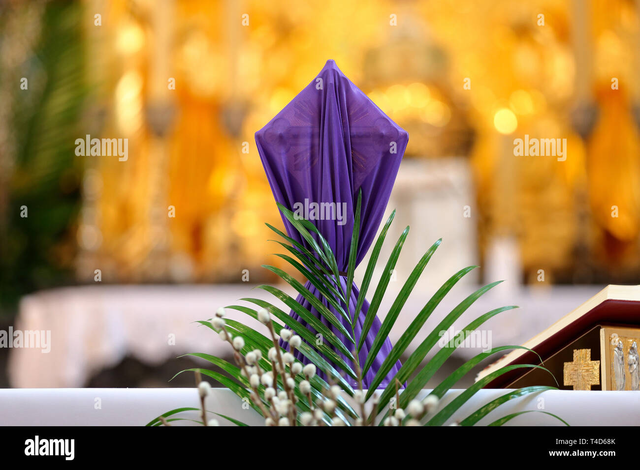 Covered cross by purple cloth on the altar in Lent Season and Holy Week