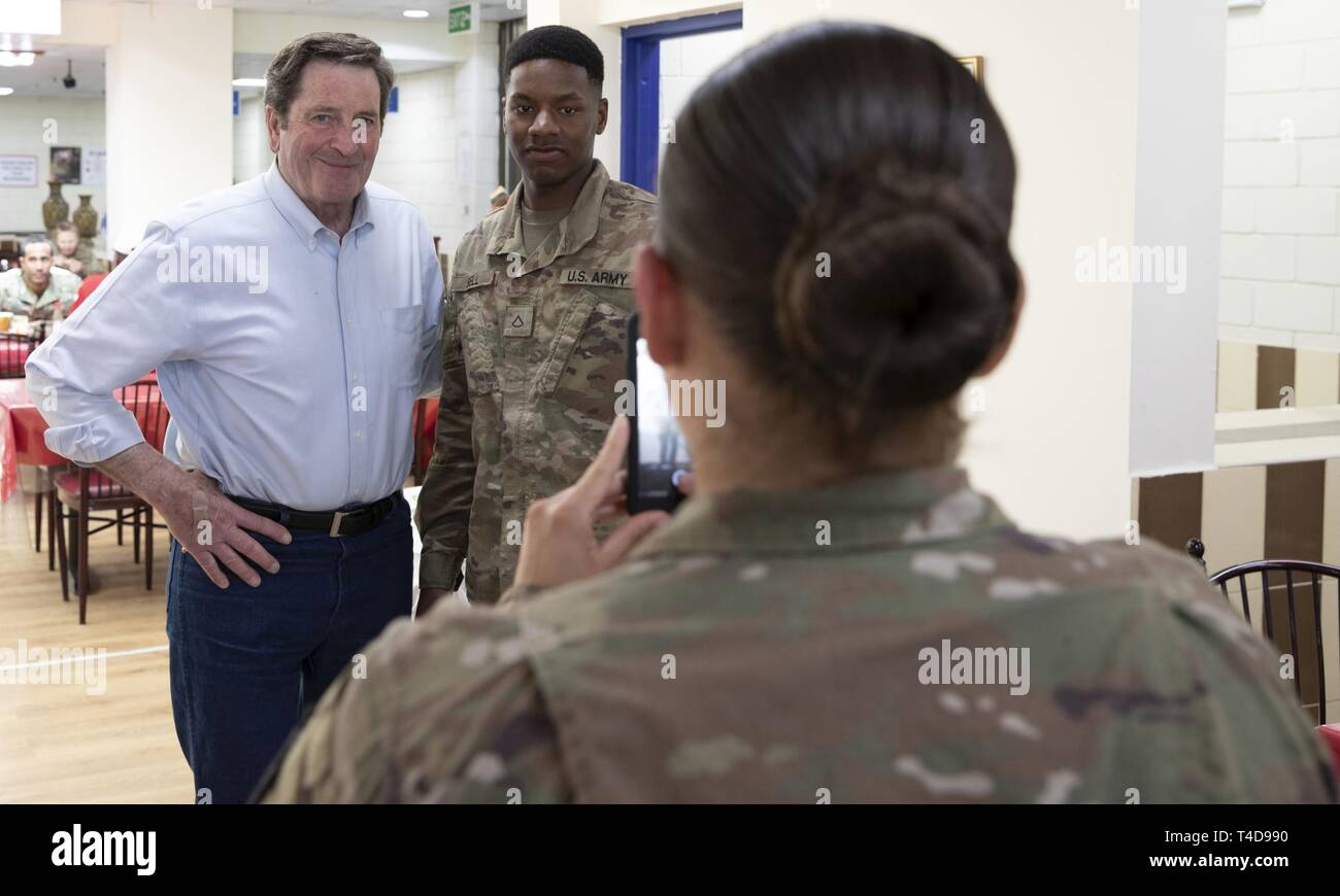 CAMP ARIFJAN, Kuwait - Rep. John Garamendi, a Democrat from California’s 3rd District, poses with Pfc. Thomas Bell, a service member from his district, at the Oasis dining facility on Camp Arifjan, Kuwait, March 20, 2019. Garamendi visited Camp Arifjan as a member of the House Armed Services Committee to engage with his supporters and listen to briefings from senior leaders in the region. Stock Photo