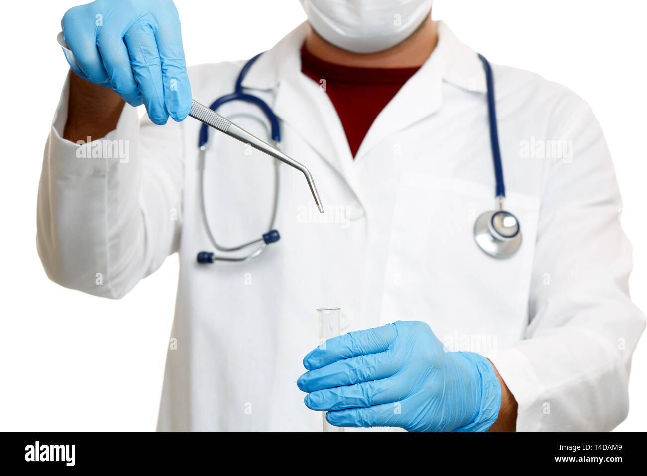 Image of doctor with phonendoscope in blue rubber gloves holding tweezers Stock Photo