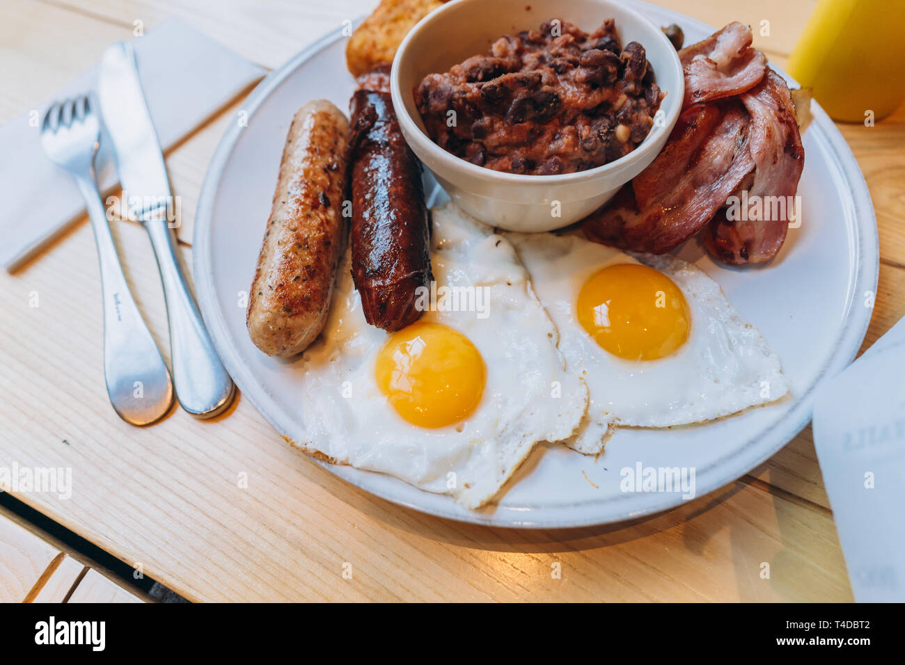 Breakfast with bacon, sausage, egg, beans and mushrooms Stock Photo - Alamy