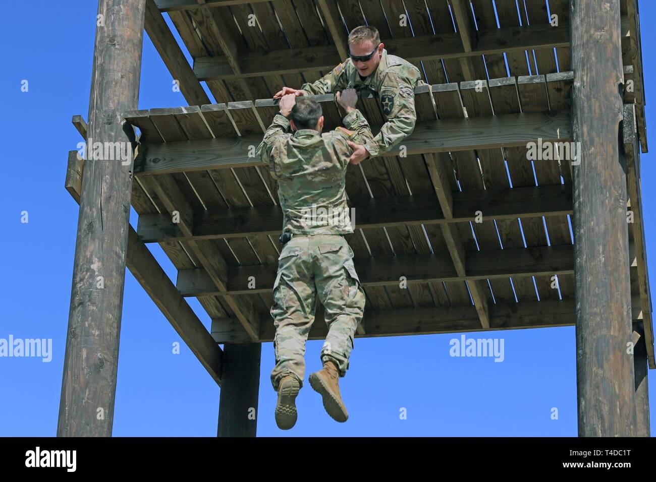 CAMP HUMPHREYS, Republic of Korea - Capt. Colby S. Miller, Phenix City, Alabama native, infantry officer, 2nd Infantry Division/ROK-U.S. Combined Division, and Capt. Jonathan J. Kaminski, Atlanta, Georgia native, field artillery officer, 2nd Combat Aviation Brigade, negotiate an obstacle course, March 22, in preparation for the 2019 Best Ranger Competition taking place at Fort Benning, Georgia. Miller and Kaminski will compete against more than 50 other Ranger teams, April 12-14. Stock Photo