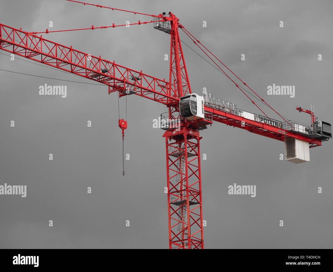 Construction tower crane with stormy sky in the back ground Stock