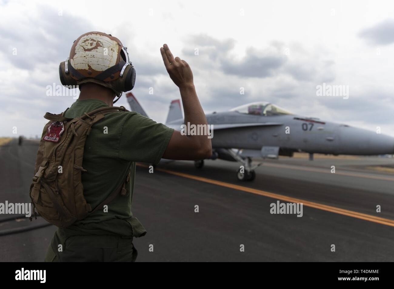 U.S. Marine Corps Lance Cpl. Daniel Vasquez refuels an F/A-18C Hornet with Marine Fighter Attack Squadron (VMFA) 232 at Clark Air Base, Philippines, April 3, 2019 during Exercise Balikatan. Balikatan is an annual exercise between the U.S. and the Philippines and comes from a Tagalog phrase meaning 'shoulder-to-shoulder,' representing the partnership between the two countries. The exercise promotes regional security and humanitarian efforts for U.S. allies and partners. Vasquez, a Fontana, California. native, is an aviation mechanic with VMFA-232. Stock Photo