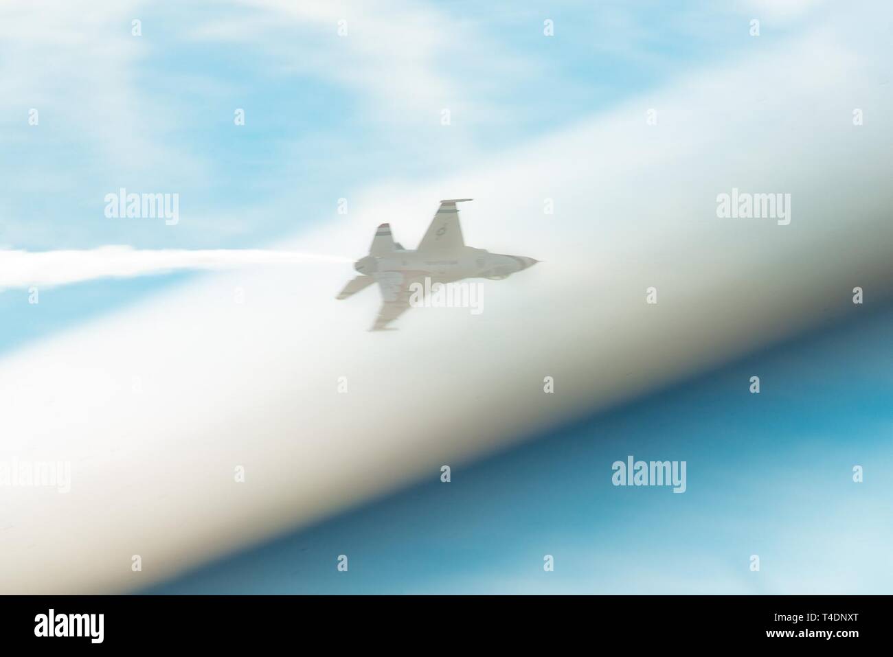A U S Air Force Thunderbirds F 16 Fighting Falcon Is Photographed Passing Behind An Object On