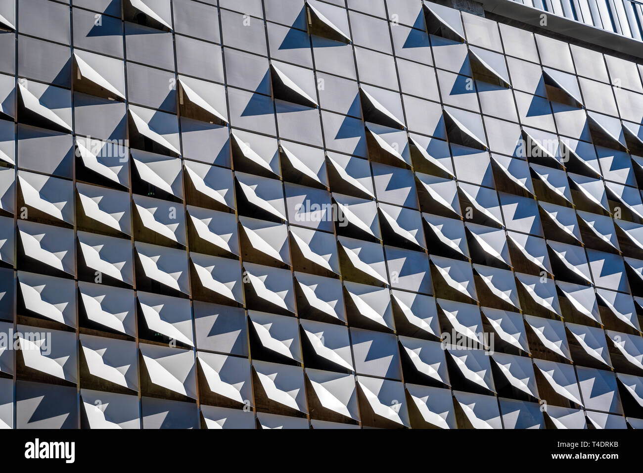 Elements of modern city architecture decorative abstract metal suspended  facing of the external walls of a sunlit multistory building, made in the  for Stock Photo - Alamy
