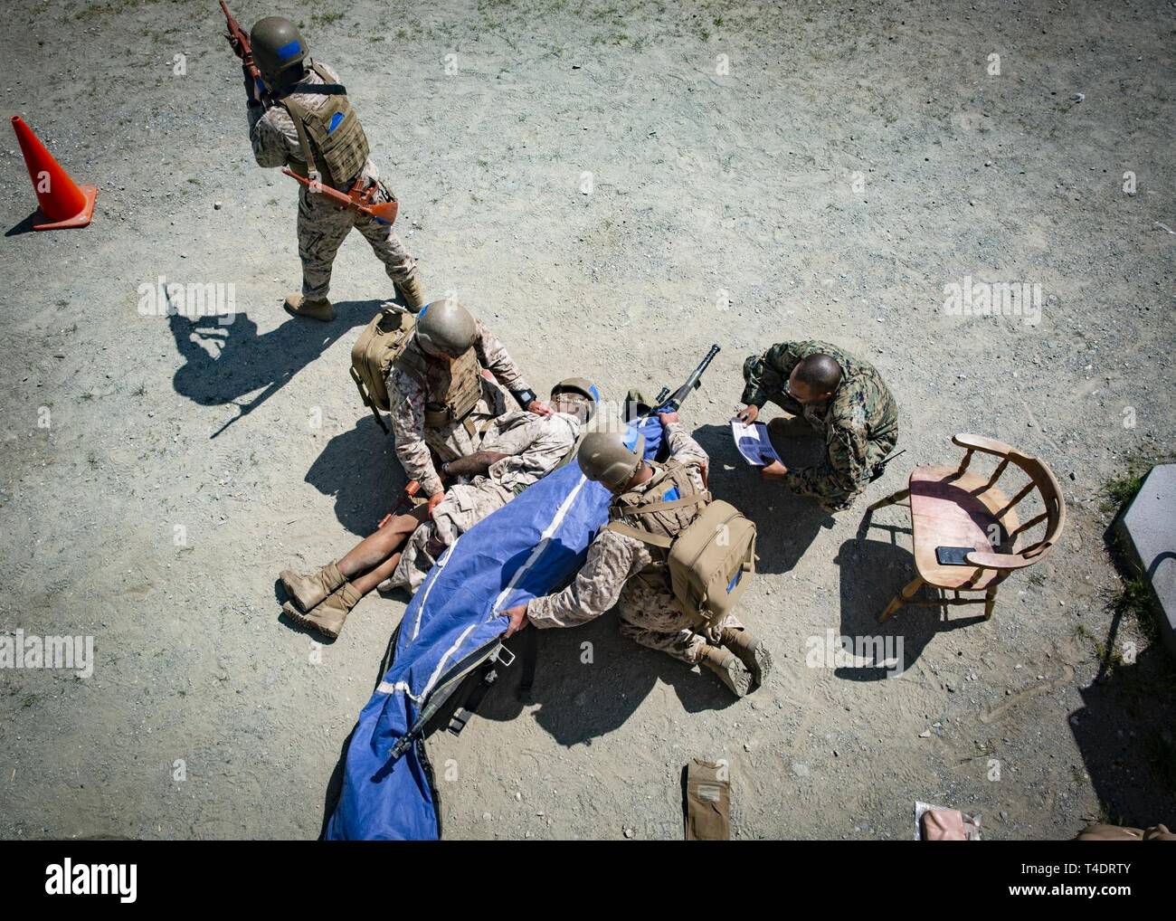U.S. Navy Sailors with Field Medical Training Battalion West move a
