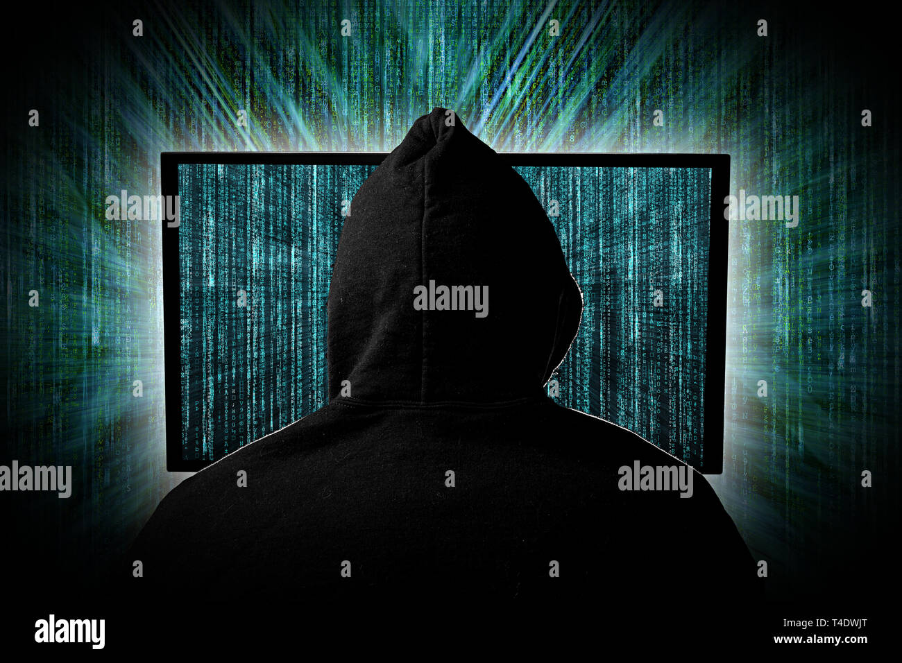 hacker  behind glowing computer monitor display in front of green source binary code background internet cyber hack attack computer concept Stock Photo